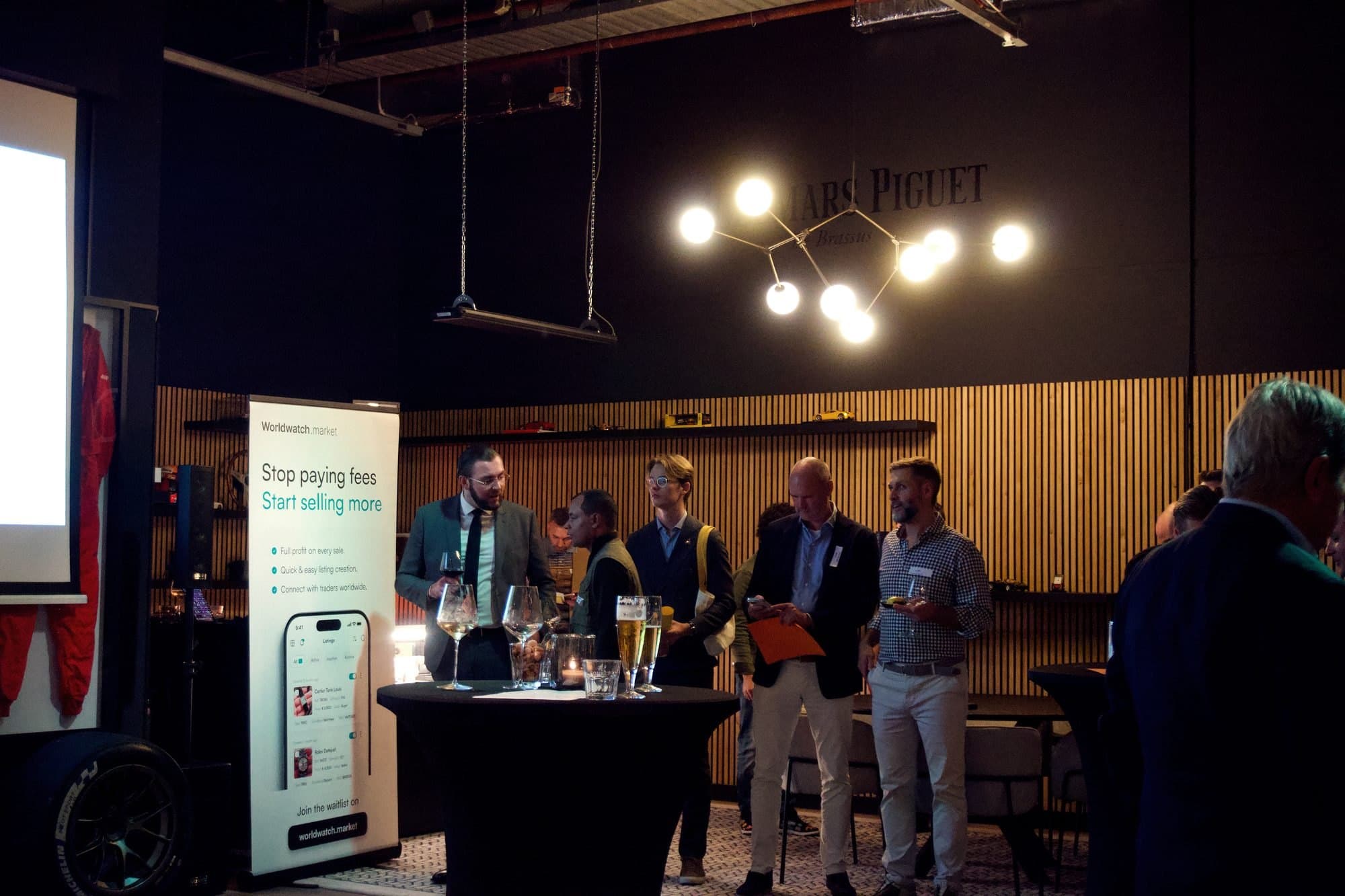 Dealers talking around a table at the Worldwatch launch